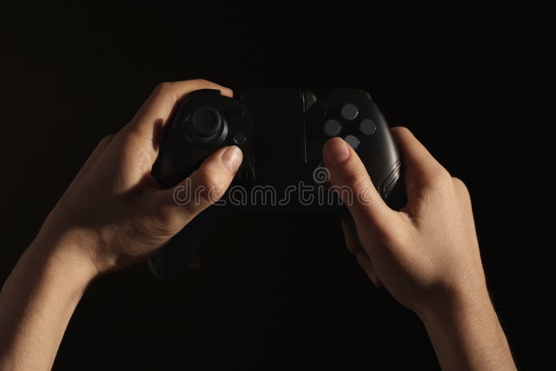 Woman holding a xbox controller and playing popular video game Fortnite on  a television and PC Stock Photo - Alamy