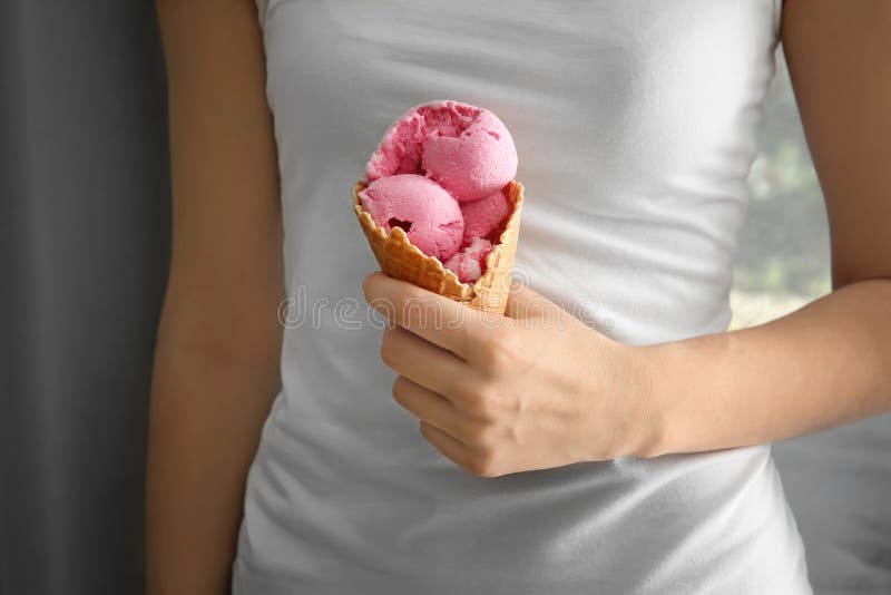 https://thumbs.dreamstime.com/b/woman-holding-waffle-cone-delicious-strawberry-ice-cream-indoors-woman-holding-waffle-cone-delicious-strawberry-ice-151124690.jpg