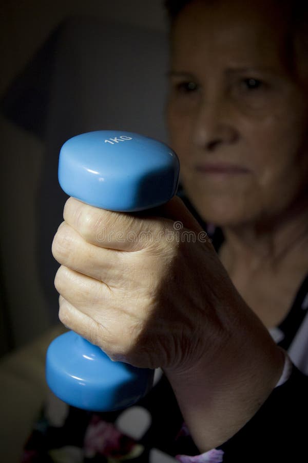 Woman holding weighs one kilogram royalty free stock image Woman holding weighs one kilogram royalty free stock image