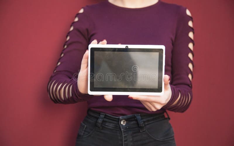 Woman holding white digital tablet stock photo Woman holding white digital tablet stock photo