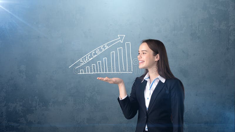 Woman holding white painted growing chart with success word on the open hand palm, isolated background. Business concept