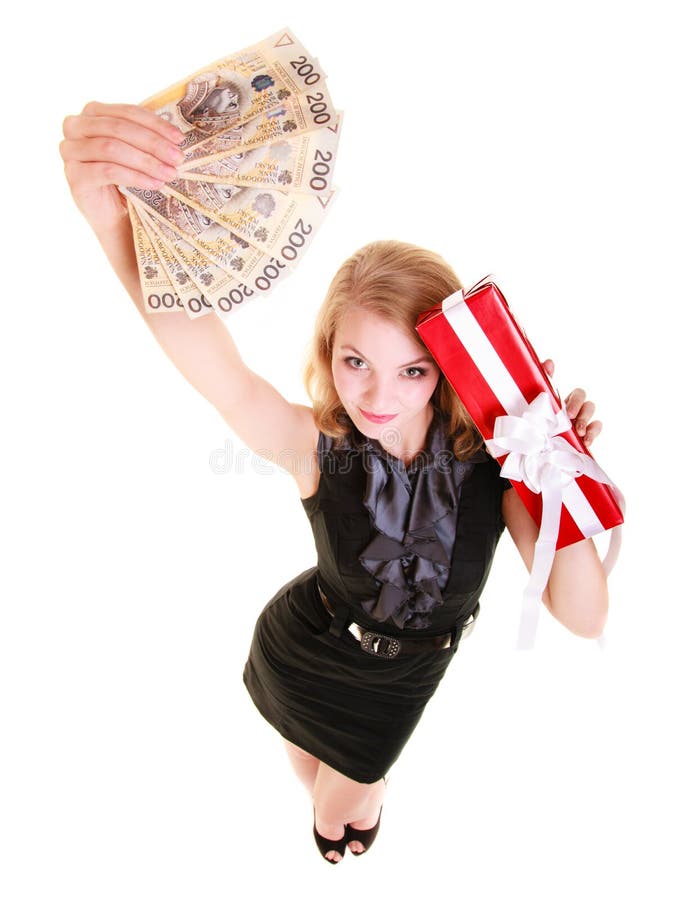 Woman holds christmas gift box and polish money. Holidays.