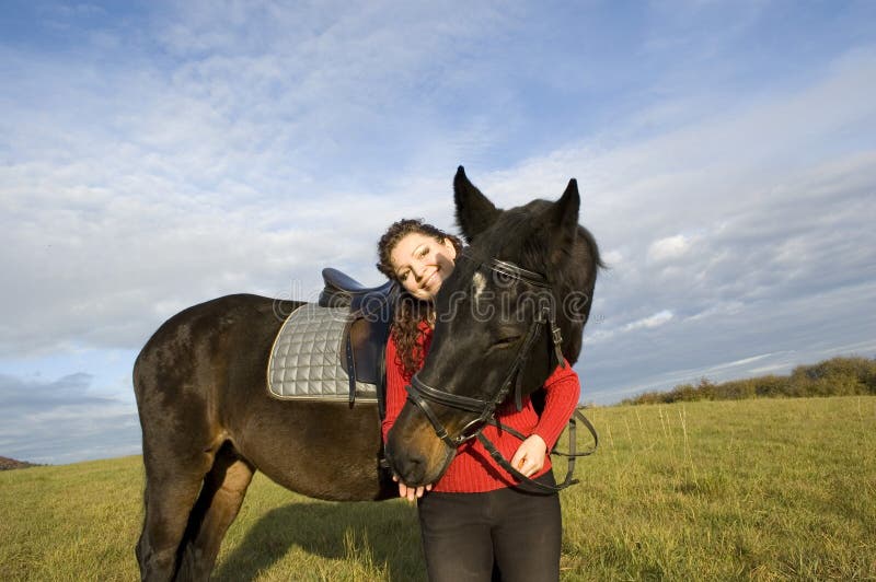 A woman and a horse. stock photo