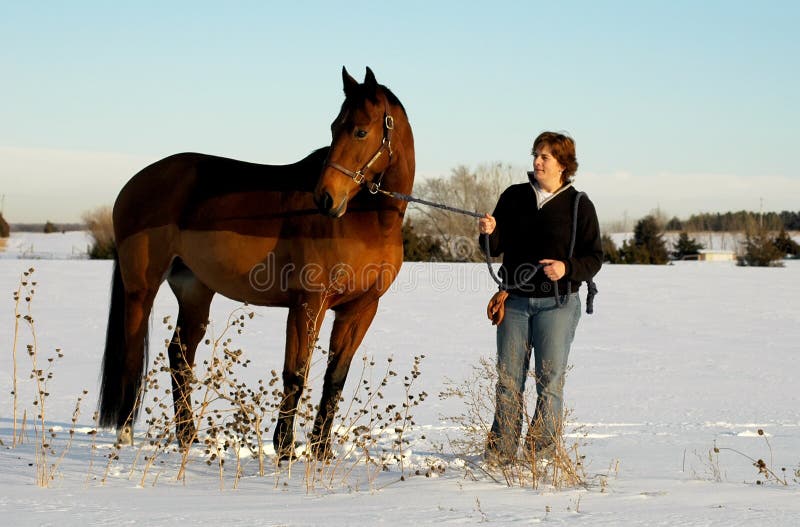 Woman and horse in Winter