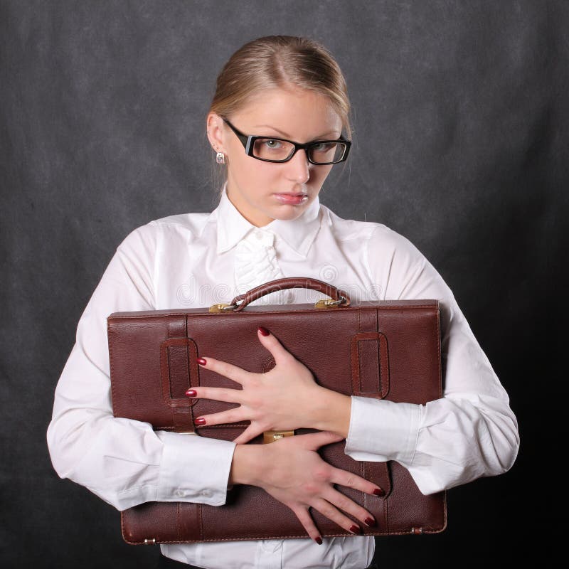 Woman hugging a briefcase