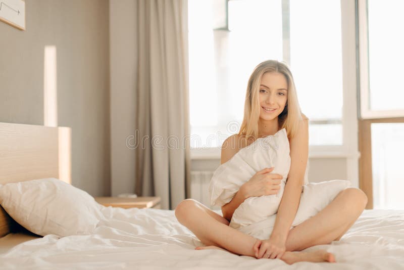 Cute Beautiful Blond Woman with a Slender Body Sitting in Bed in Black  Underwear Stock Photo - Image of beauty, freshness: 194173046