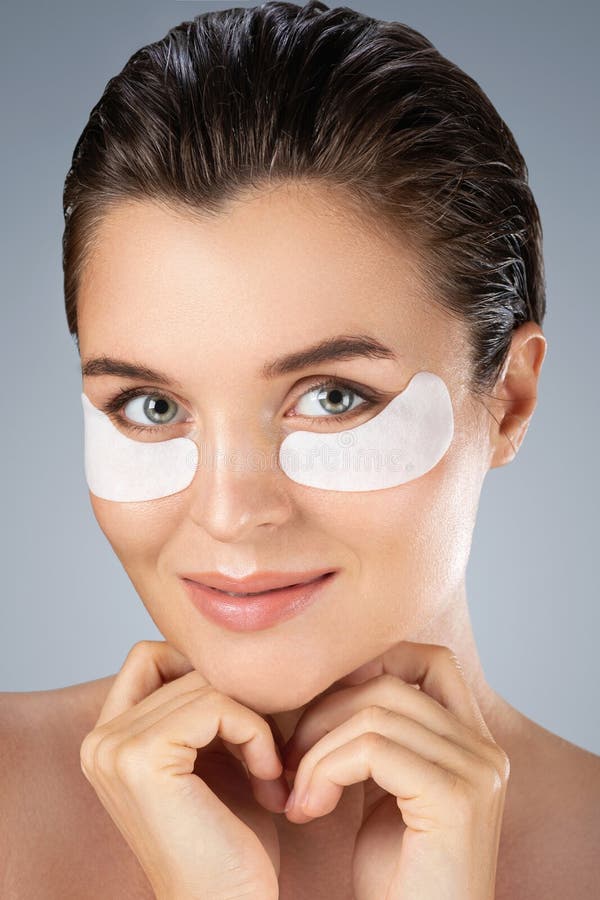 Woman with Hydrating Eye Patches Under Her Eyes O Stock Photo - Image ...