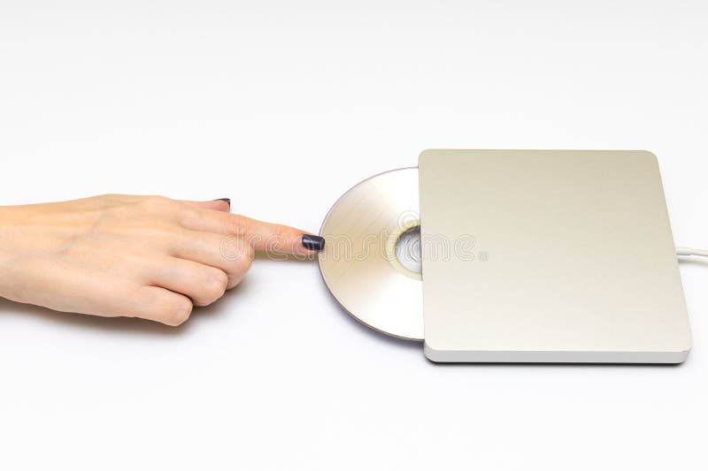 Woman Inserting a Laser Disc into a Disk Drive. Stock Photo Image of