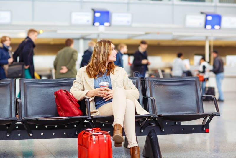 Woman at international airport waiting for flight