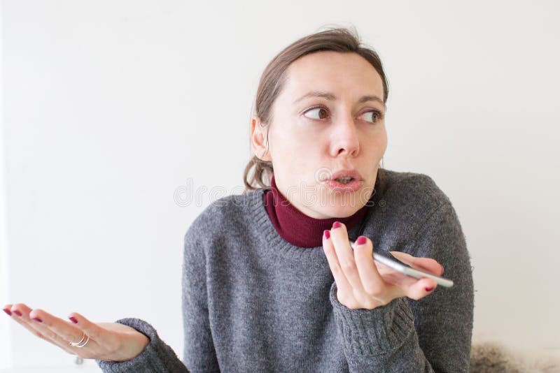 Woman leaving a voice massage on the phone royalty free stock photo Woman leaving a voice massage on the phone royalty free stock photo