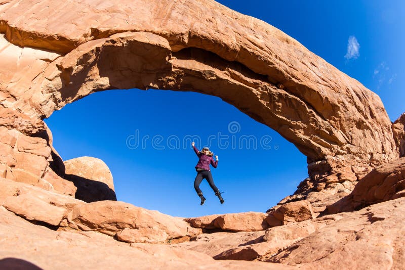 Woman Jumping in Arches stock photos Woman Jumping in Arches stock photos