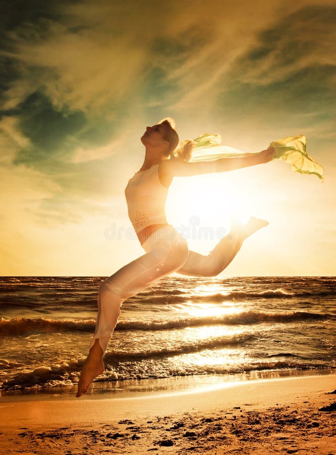 Woman jumping on a beach