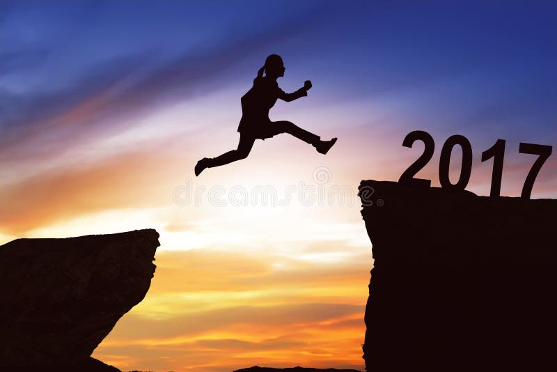 Woman jumping on the hill toward 2017 royalty free stock images Woman jumping on the hill toward 2017 royalty free stock images