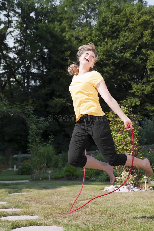 Woman Jumping Rope in the Garden Stock Image Image of summer, health 33099301
