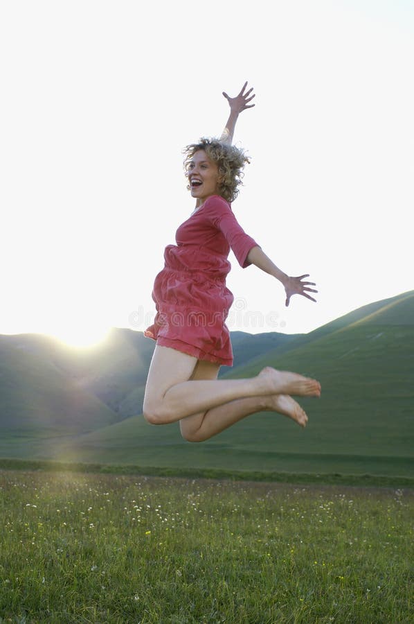 Woman Jumping While Screaming In Park