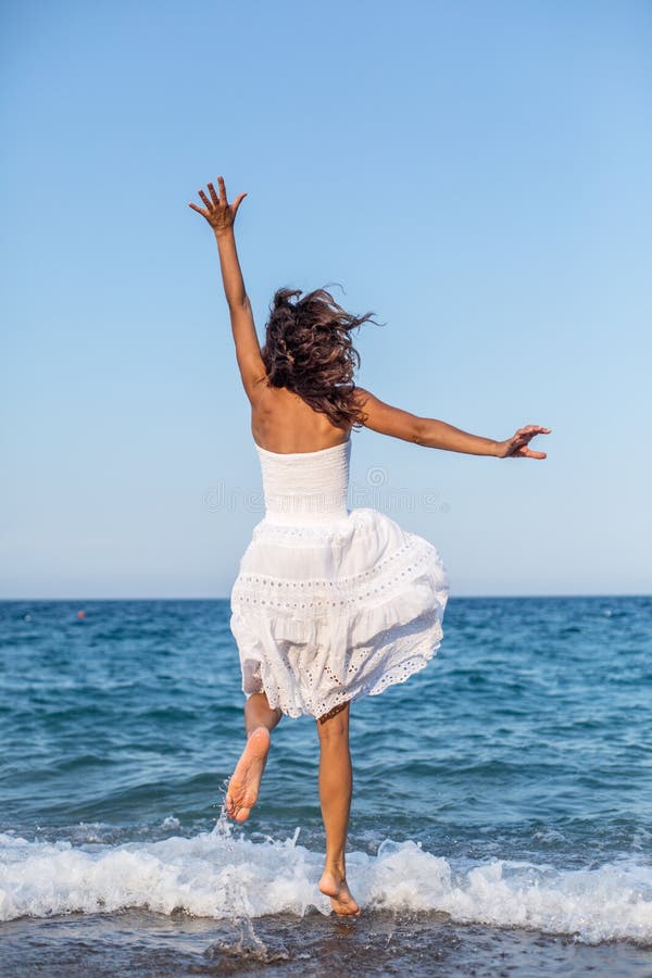 Jumping coast scarf woman stock photo. Image of ocean - 9896152