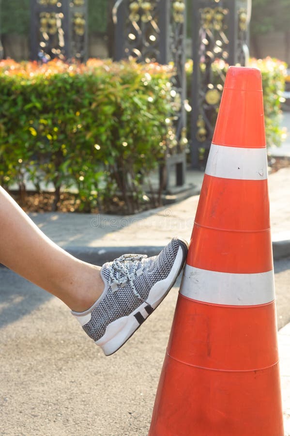 Chinese Girl Sits On Traffic Cone