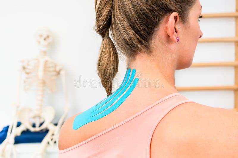 Woman with Kinesio Tape on Shoulder in Physiotherapy Stock Image