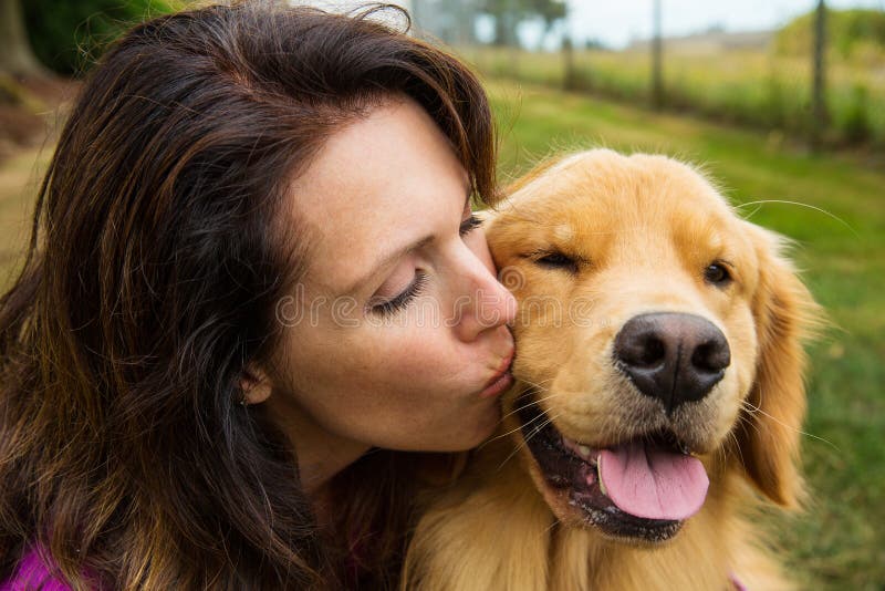 Woman kissing her dog stock photo. Image of love, loyal 33176440