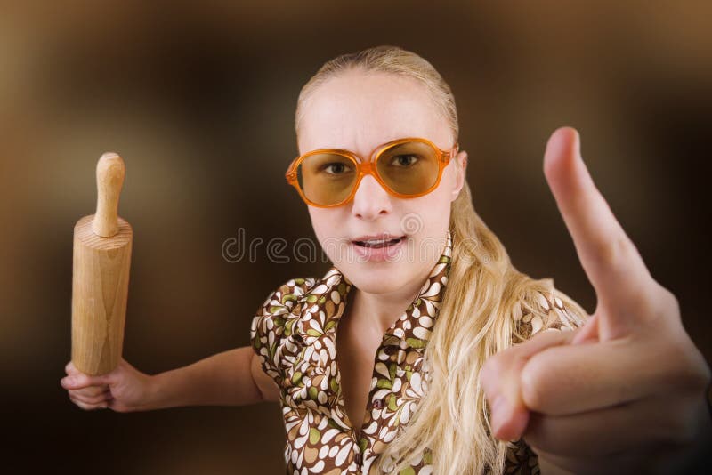 woman with kitchen tool (rolling pin)