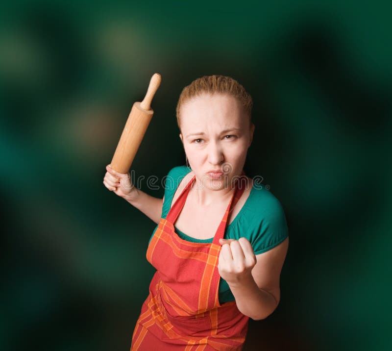 Woman with kitchen tool (rolling pin)