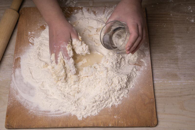 A Woman Kneads The Dough. Plywood Cutting Board, Wooden Flour Sieve And ...