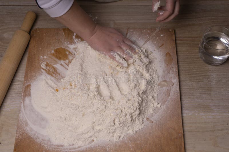 A Woman Kneads the Dough. Plywood Cutting Board, Wooden Flour Sieve and ...