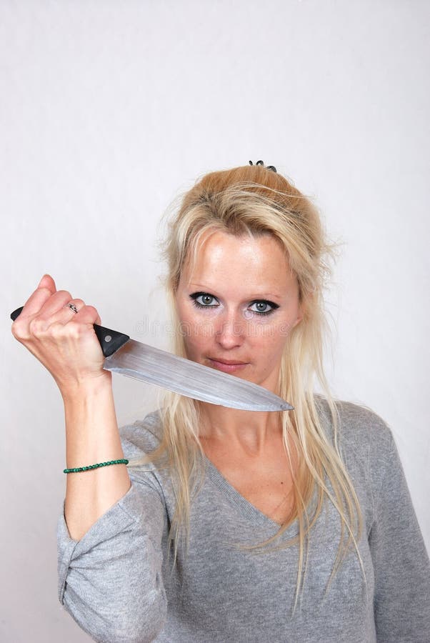 Woman with knife stock image. Image of standing, object 49219761