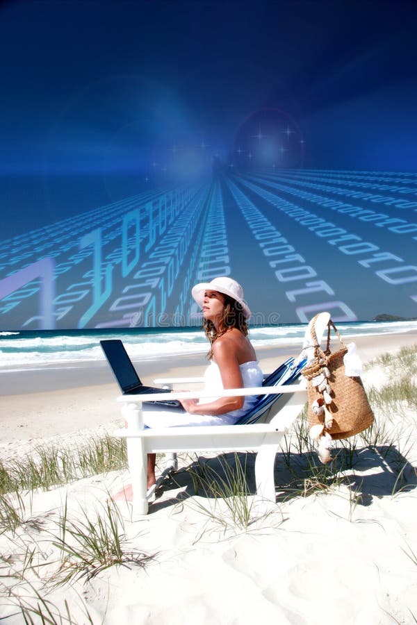 Woman with laptop on beach stock image Woman with laptop on beach stock image
