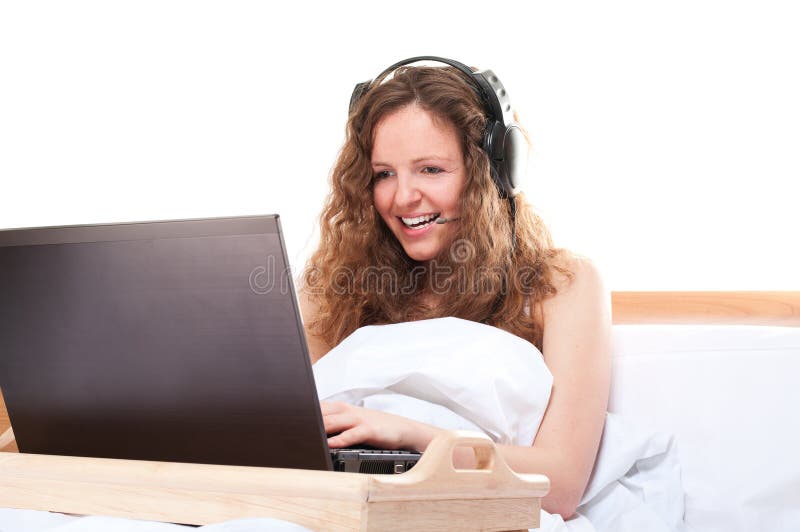 Woman with laptop and headset