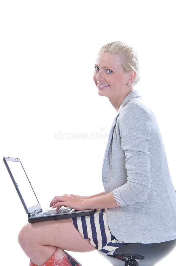Woman with a laptop isolated on white
