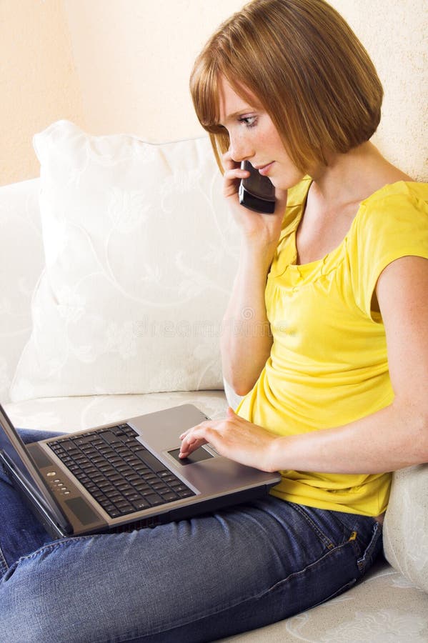 Woman with a laptop on a lounge