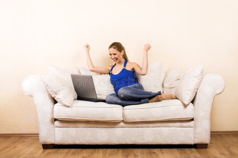 Woman with a laptop on a lounge