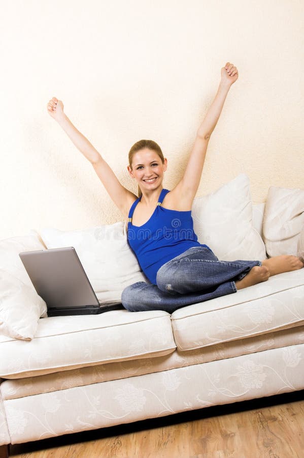 Woman with a laptop on a lounge