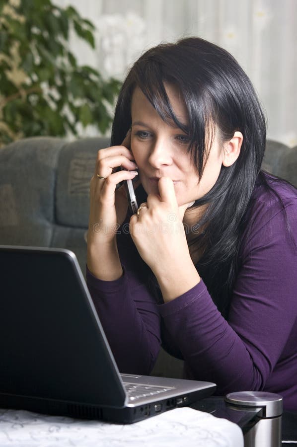 Woman on laptop and phone