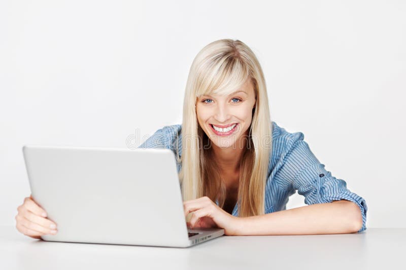 Woman using laptop at home stock image. Image of front - 22856833