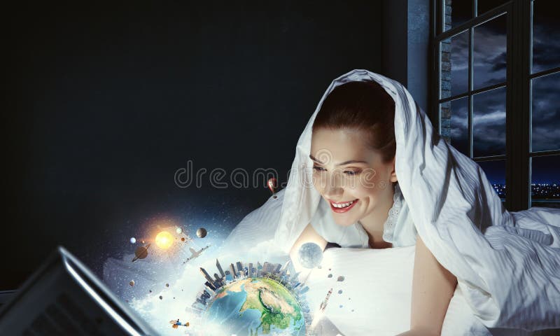 Woman with laptop submerged into virtual reality stock photo Woman with laptop submerged into virtual reality stock photo