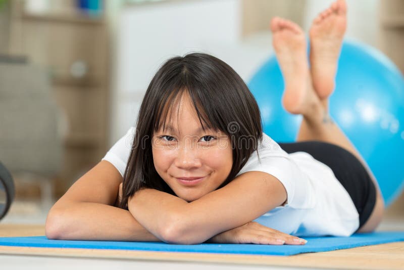 Woman Laying in Exercise Clothes Stock Image - Image of posing