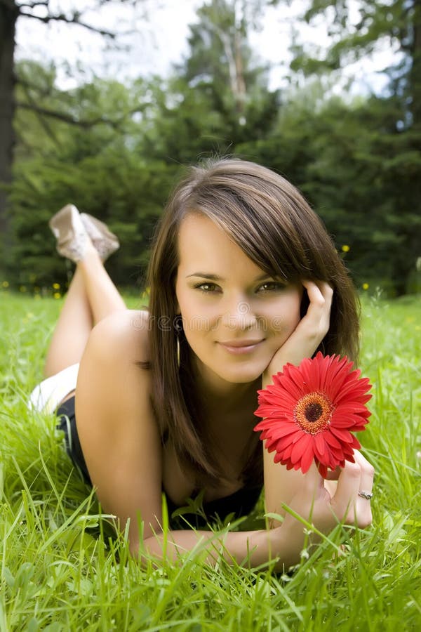 Woman laying On A Meadow