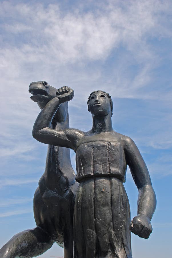 Woman Leading Horse Statue stock photo. Image of raise 32016666