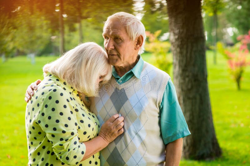 Woman leaning on man s shoulder.