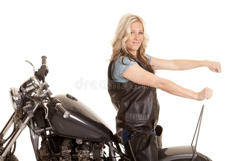 Woman leather ride motorcycle backwards