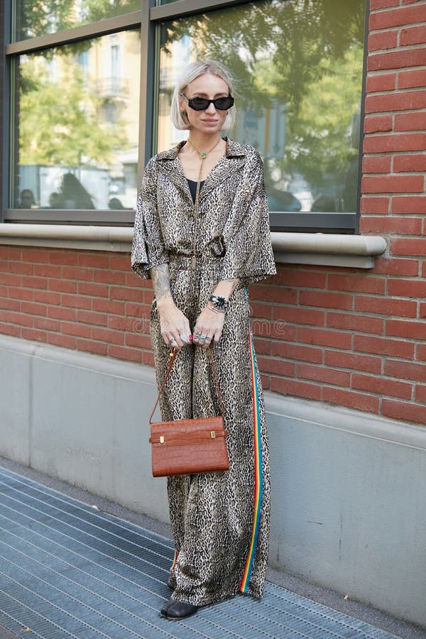 Woman with Brown Leather Fendi Bag and Fur Coat before Emporio