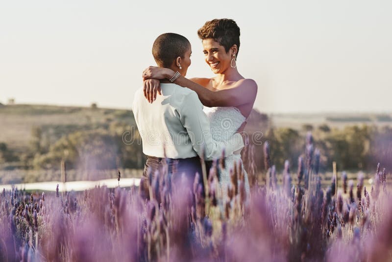 Woman, lesbian couple and hug in embrace for LGBT relationship, wedding or marriage commitment in nature. Happy gay royalty free stock images
