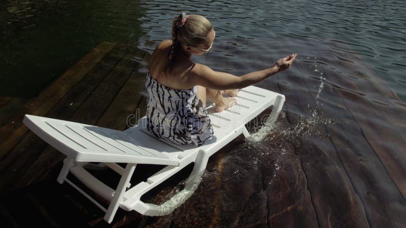 Woman Lie on a Sunbed in Sunglasses and a Boho Silk Shawl. Girl Rest on ...