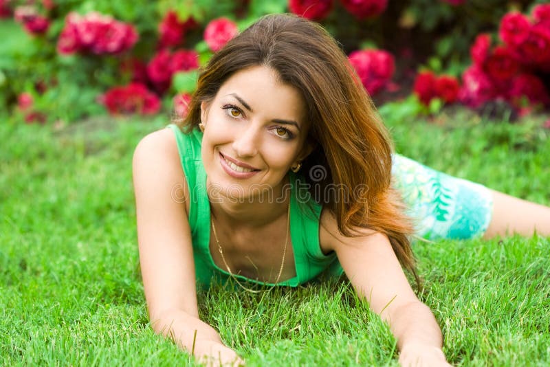 Woman lies on a grass