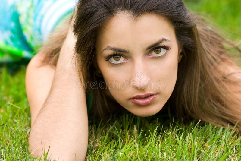 Woman lies on a grass