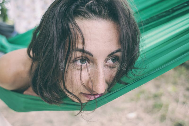 The woman lies in a hammock. royalty free stock photos The woman lies in a hammock. royalty free stock photos