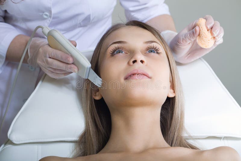 Woman lies on a table in a beauty spa stock photo