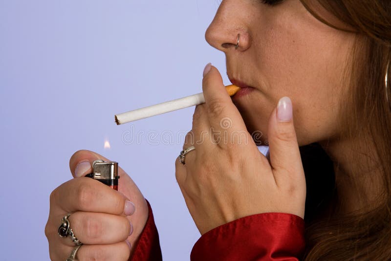 Woman lighting cigarette stock photo. Image of smoker 16535072